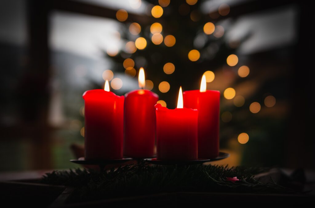 A photo of four candles arranged as an advent wreath